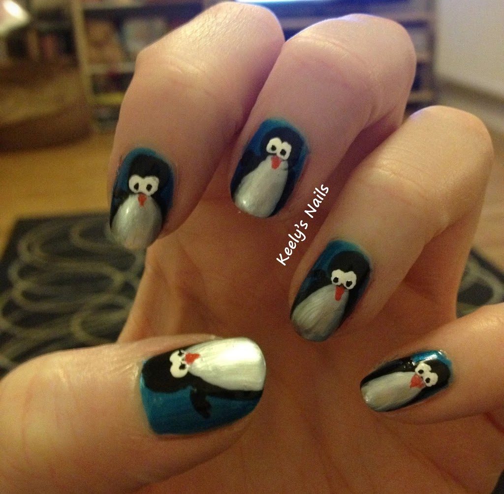 Freehand cute penguin nail art