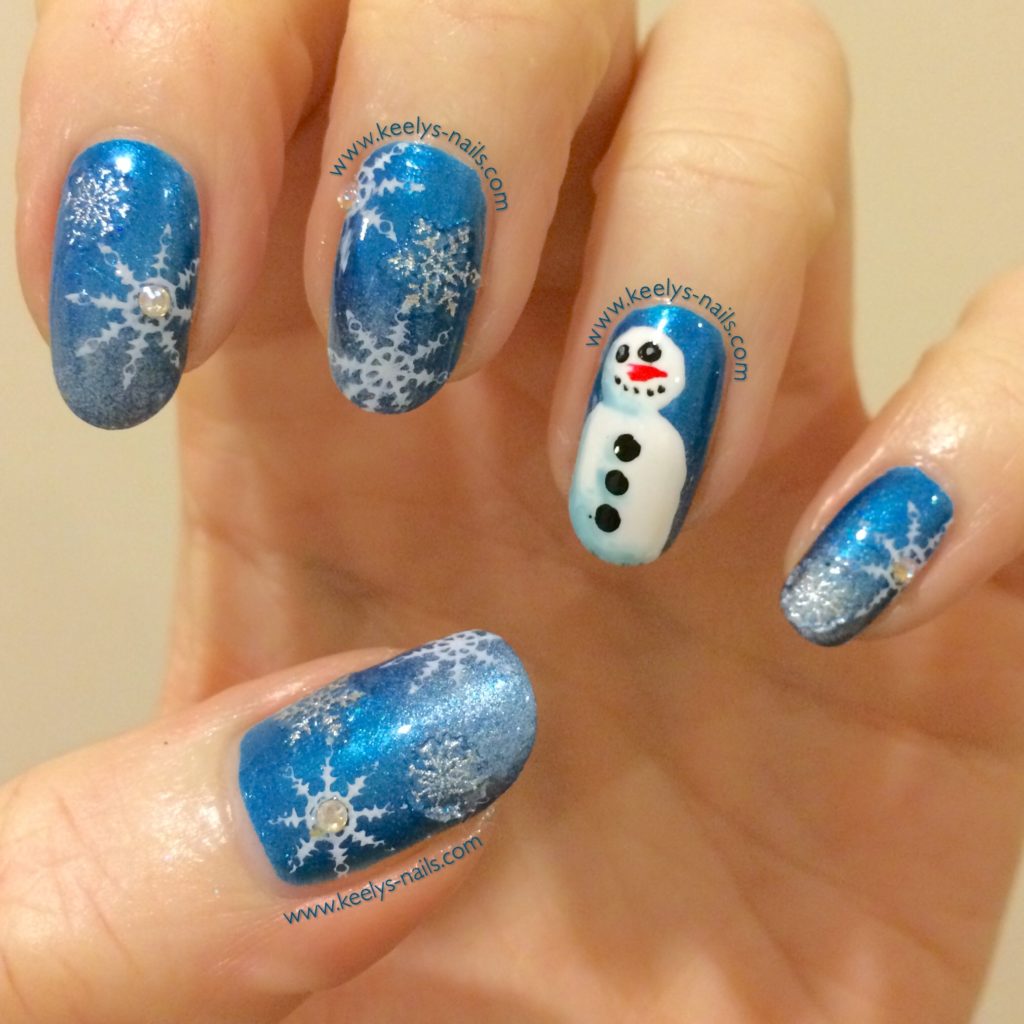 Freehand snowman nail art design