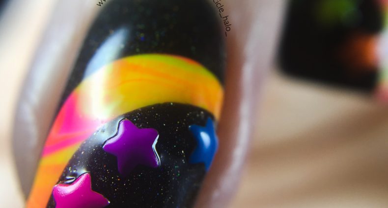 Neon Star Studs macro little finger