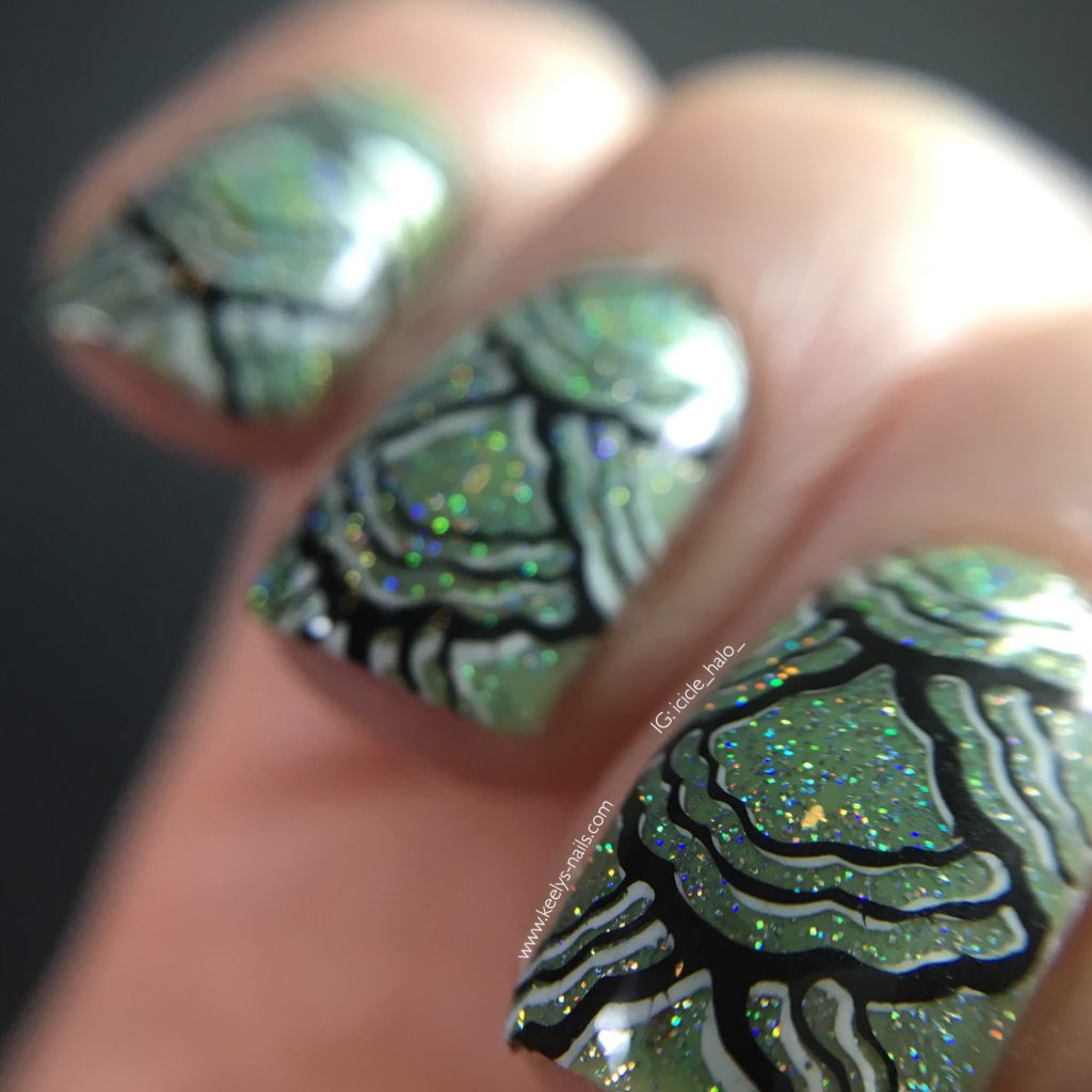 Macro of mint green mermaid tail nail art