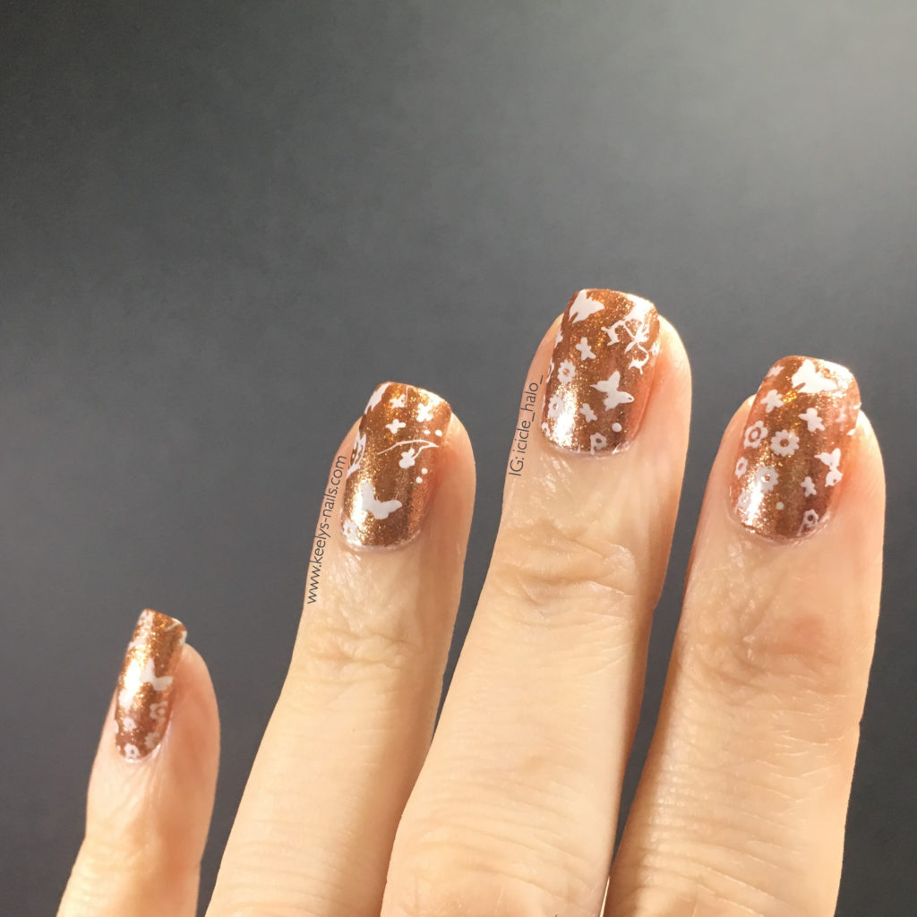 Flowers and butterflies stamped on Rose Gold nail polish