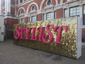 Stylist Live at Kensington Olympia - giant glitter logo outside the show