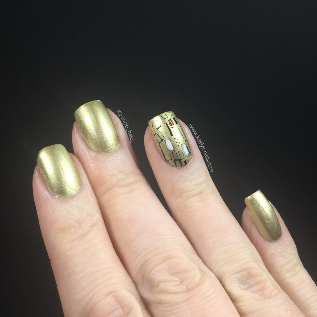 Gold foil polish and stamping created this Gustav Klimt nail art - right hand fingers extended