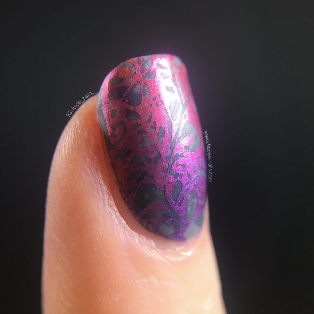 Right hand index finger macro, three-quarter view, showing grey marbling under stamping