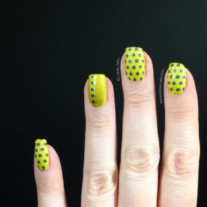 Left hand: chartreuse base with minimalist double stamping and a matte finish